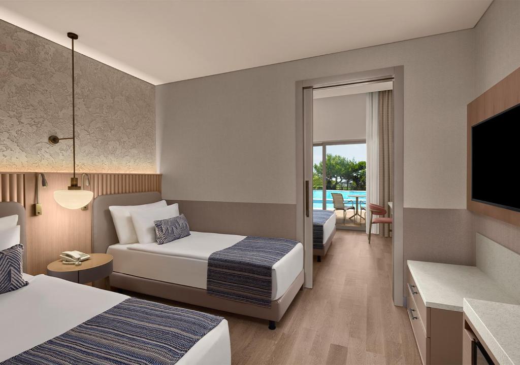 Postel nebo postele na pokoji v ubytování Akra Sorgun Tui Blue Sensatori - Ultra All Inclusive