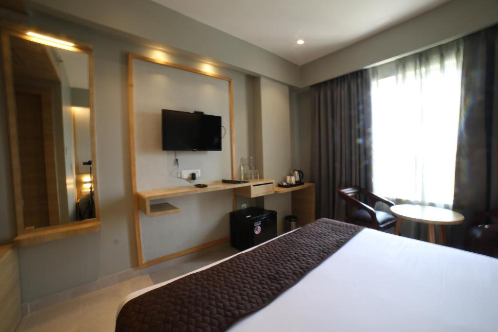 TV a/nebo společenská místnost v ubytování Northin Hotel