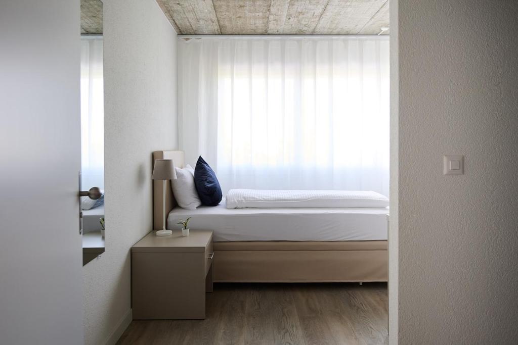Postel nebo postele na pokoji v ubytování Aabach Hotel