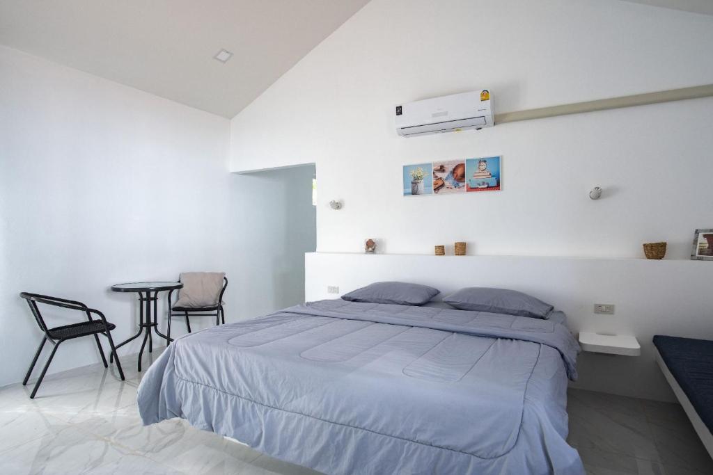 Postel nebo postele na pokoji v ubytování Corsita Resort Koh Mak