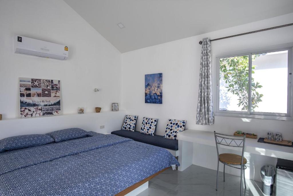 Postel nebo postele na pokoji v ubytování Corsita Resort Koh Mak