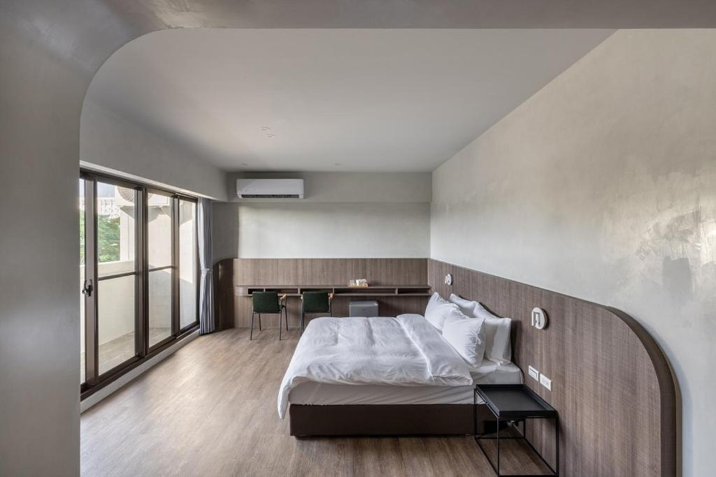 Postel nebo postele na pokoji v ubytování H suite inn