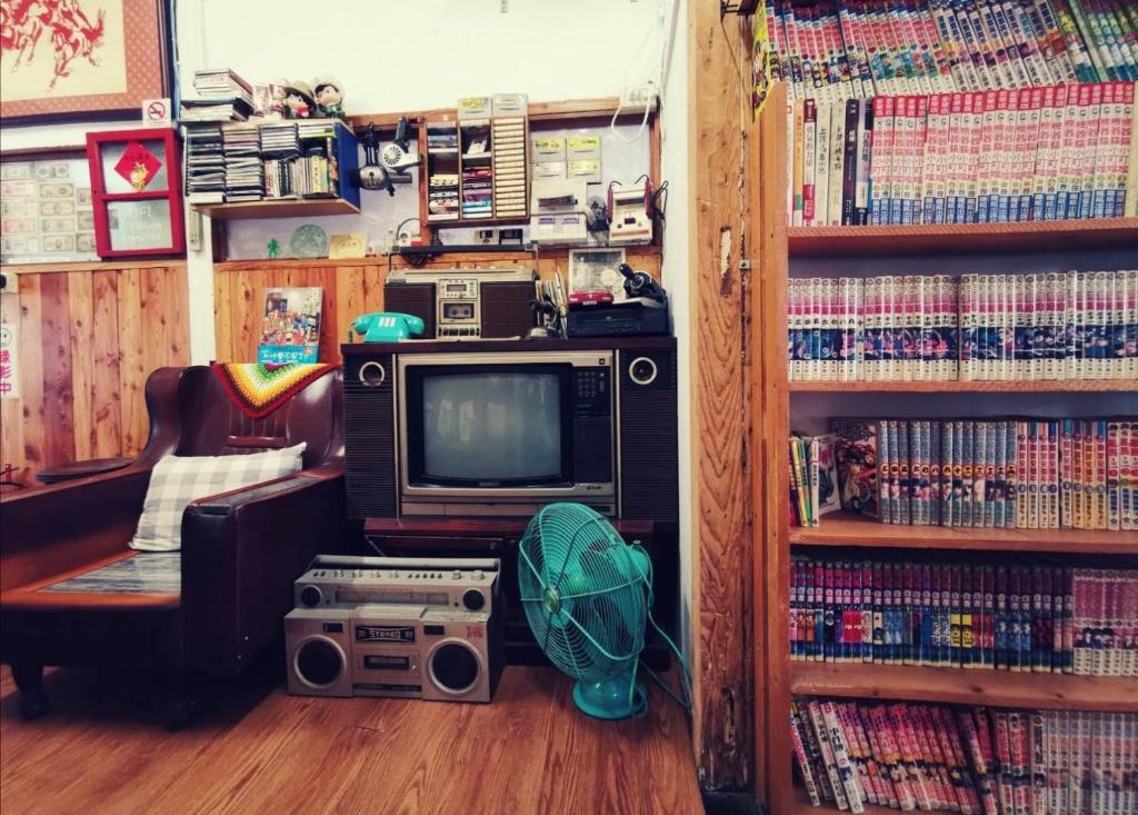 TV a/nebo společenská místnost v ubytování Huangpu Hostel