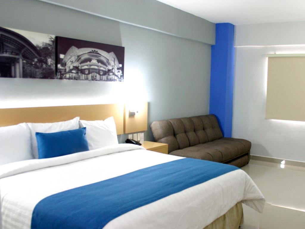 Postel nebo postele na pokoji v ubytování Hotel Urbainn