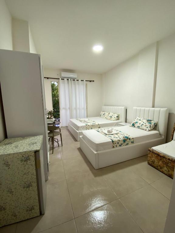Postel nebo postele na pokoji v ubytování Arli Eris Rent rooms