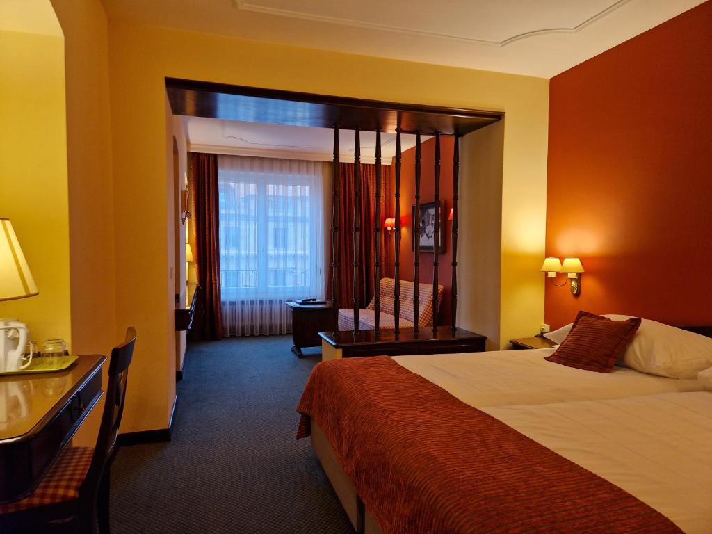 Postel nebo postele na pokoji v ubytování Hotel Athmos