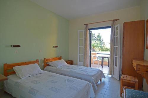 Postel nebo postele na pokoji v ubytování Jasmine Apartments