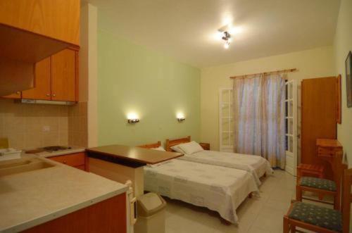 Postel nebo postele na pokoji v ubytování Jasmine Apartments
