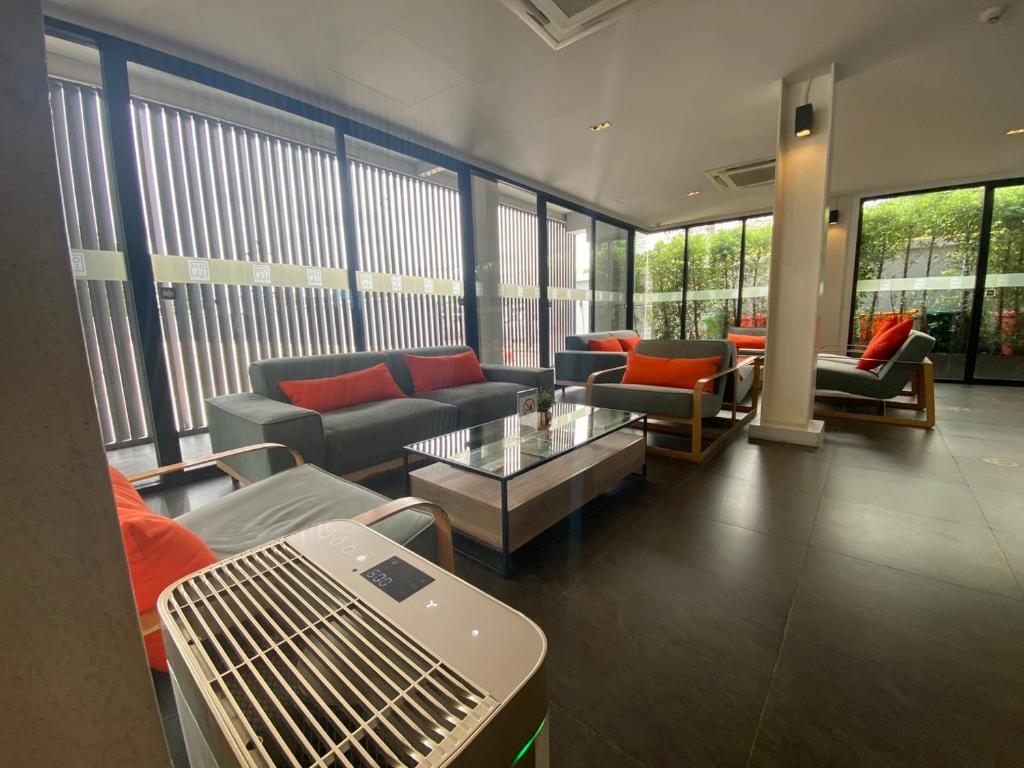 A relaxed lobby seating area with a large communal coffee table.