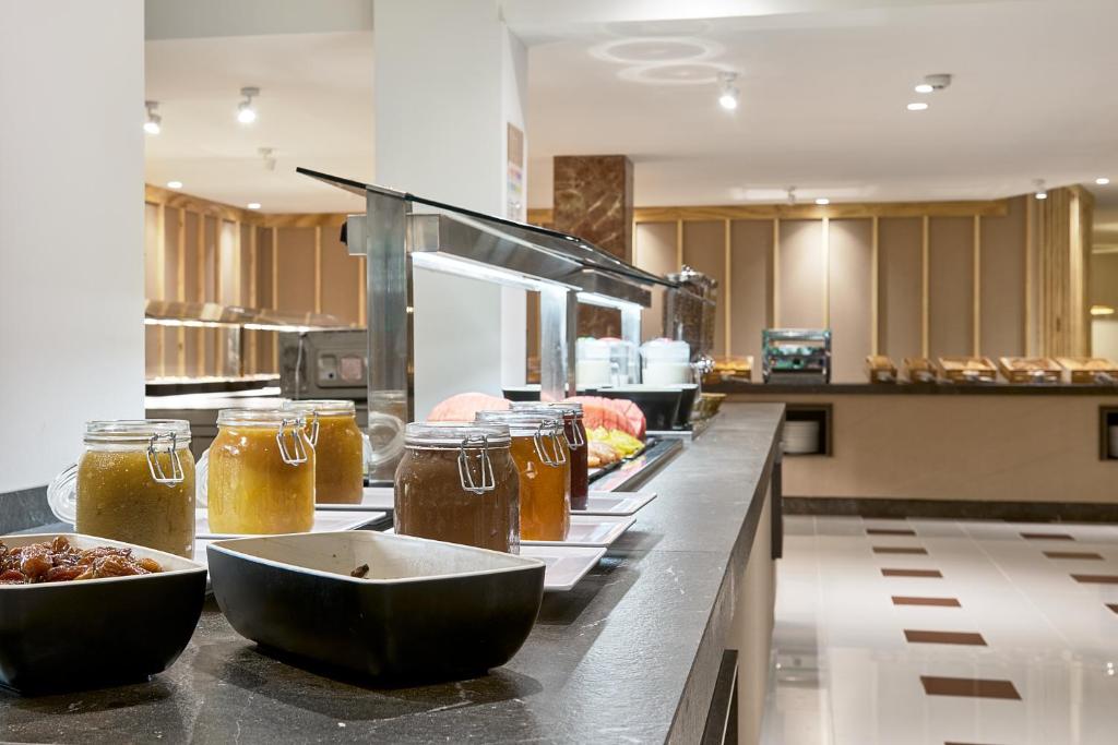 a kitchen with jars of honey on a counter at tent Bahia de Palma in El Arenal