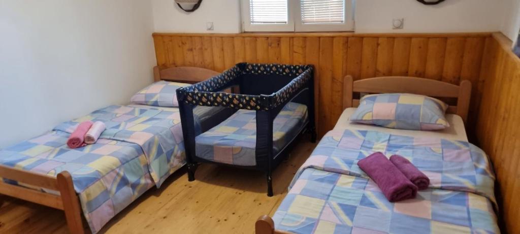Postel nebo postele na pokoji v ubytování Green Pine House