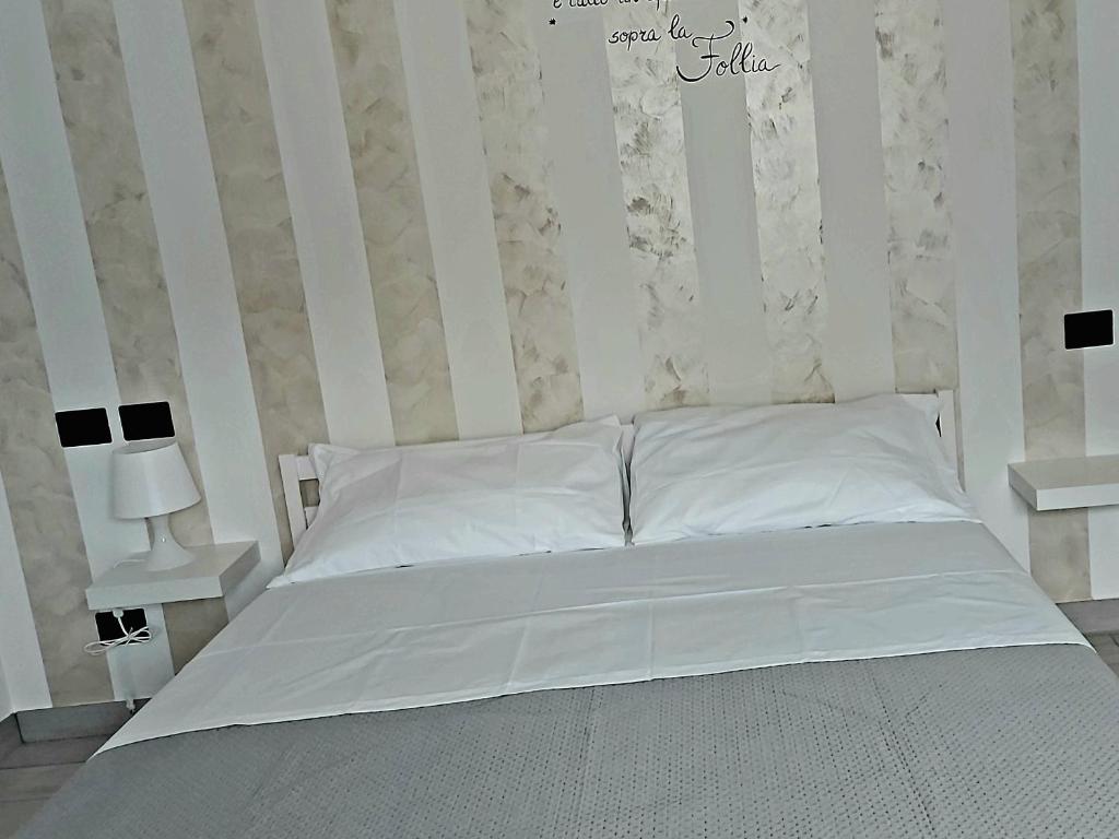 Postel nebo postele na pokoji v ubytování A casa di Adua