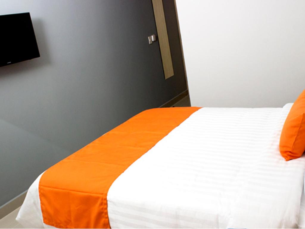 Postel nebo postele na pokoji v ubytování Hotel Urbainn