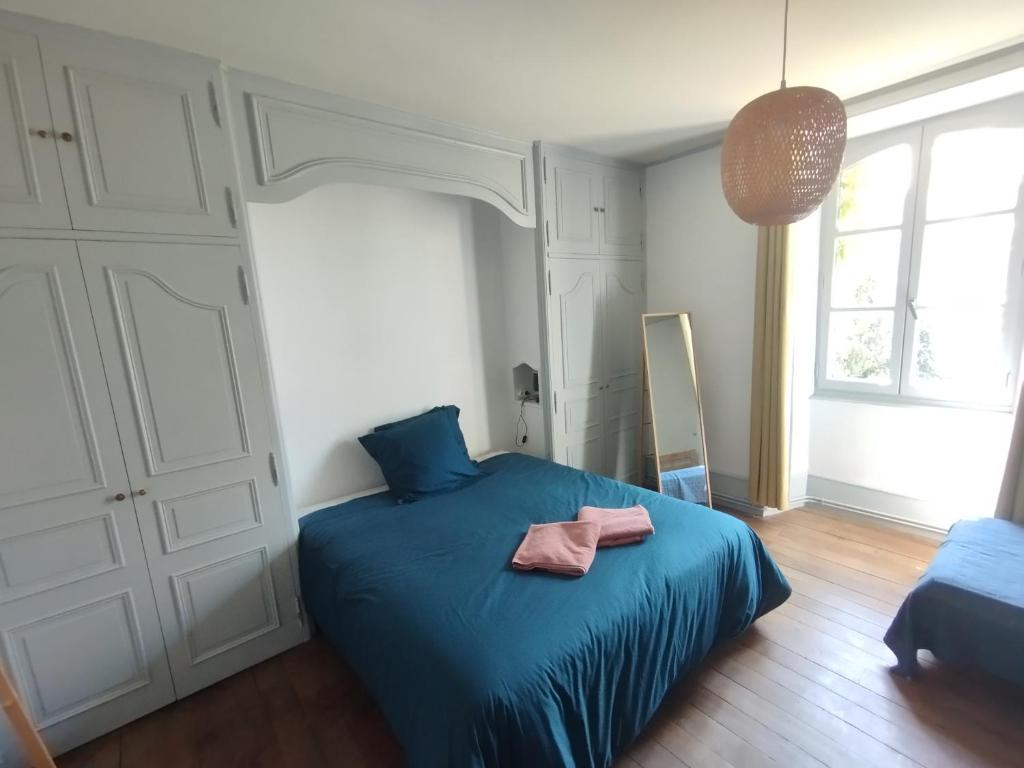 Postel nebo postele na pokoji v ubytování Chambres d'hôtes l'arche d'Yvann