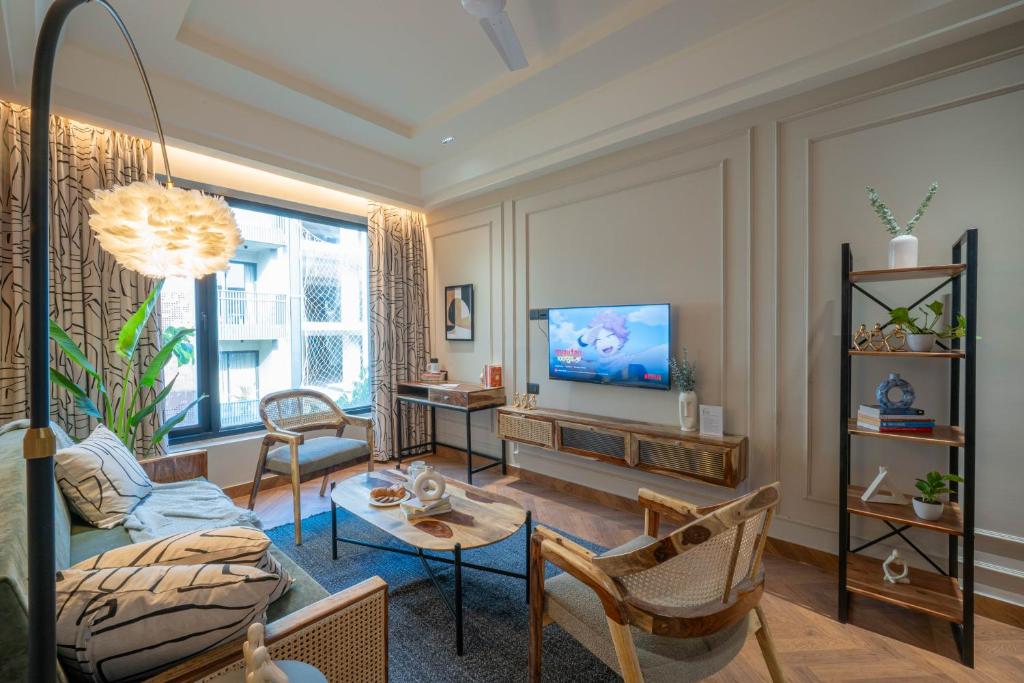 TV a/nebo společenská místnost v ubytování Boutique Hotel By One Tree