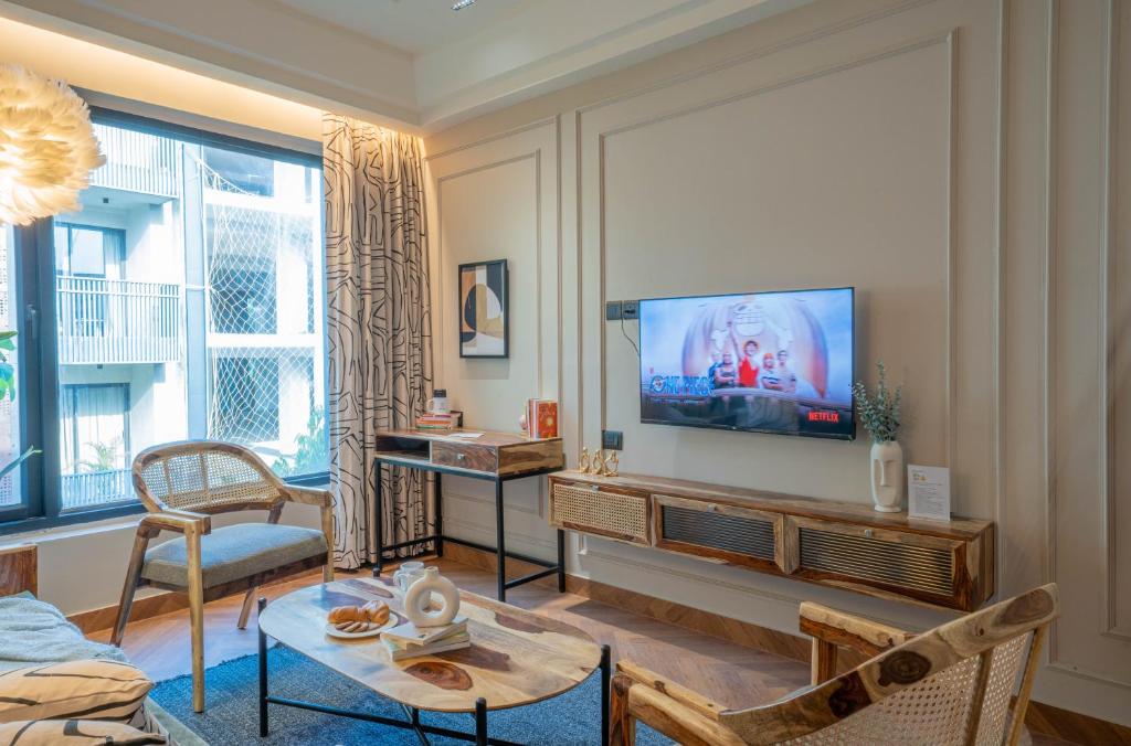 TV a/nebo společenská místnost v ubytování Boutique Hotel By One Tree