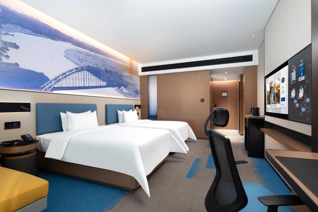 TV a/nebo společenská místnost v ubytování Hampton by Hilton Guigang