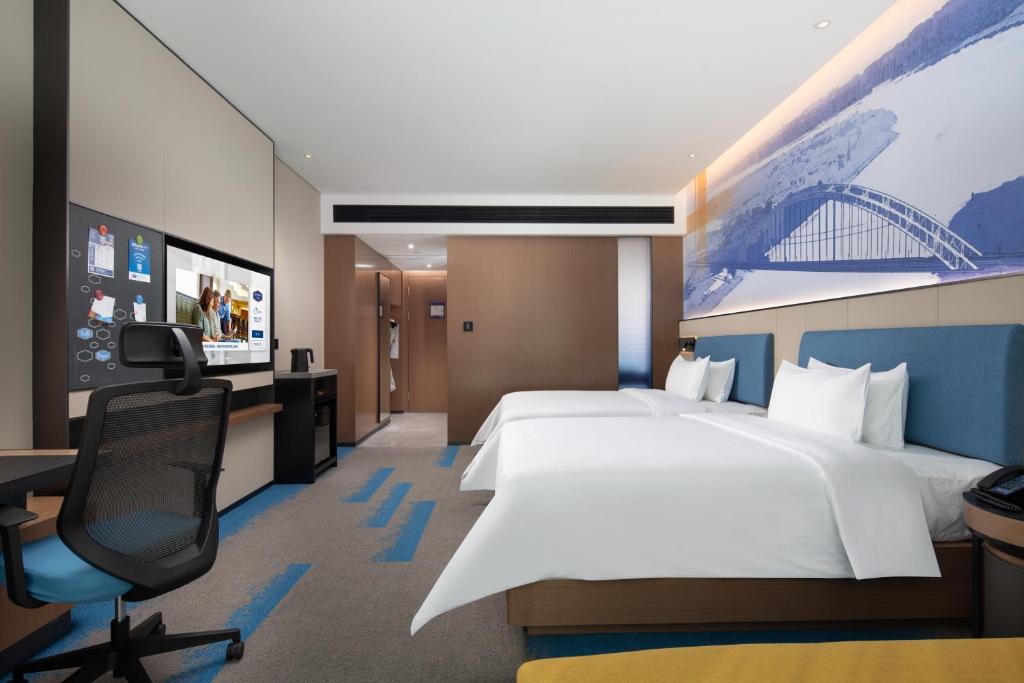 TV a/nebo společenská místnost v ubytování Hampton by Hilton Guigang