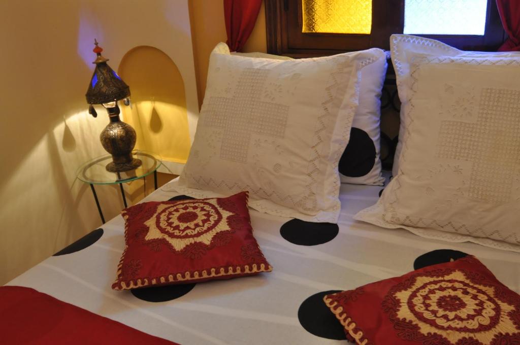 Postel nebo postele na pokoji v ubytování Riad La Famille