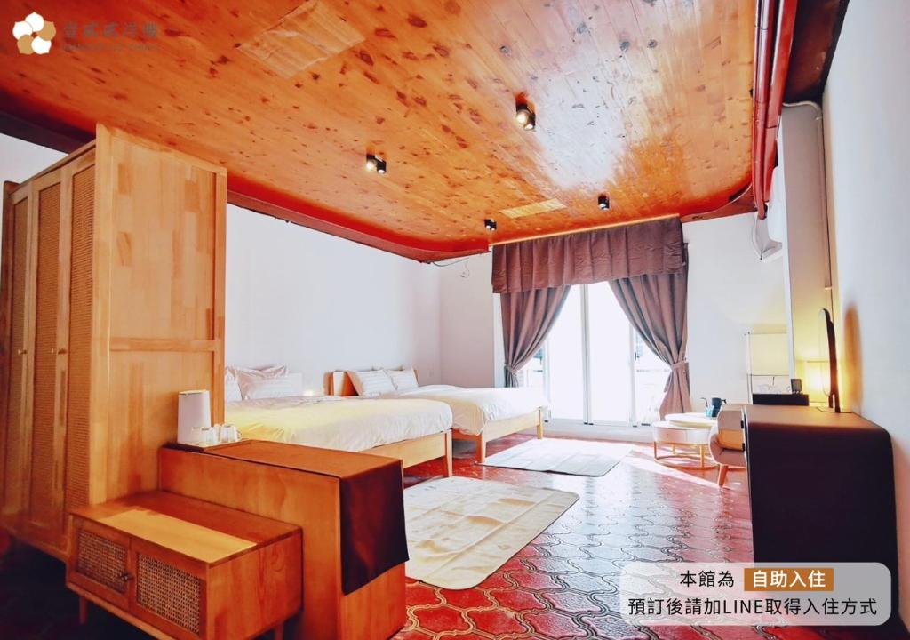 Postel nebo postele na pokoji v ubytování 壹貳貳洋樓 l 自助入住 l 無人櫃檯