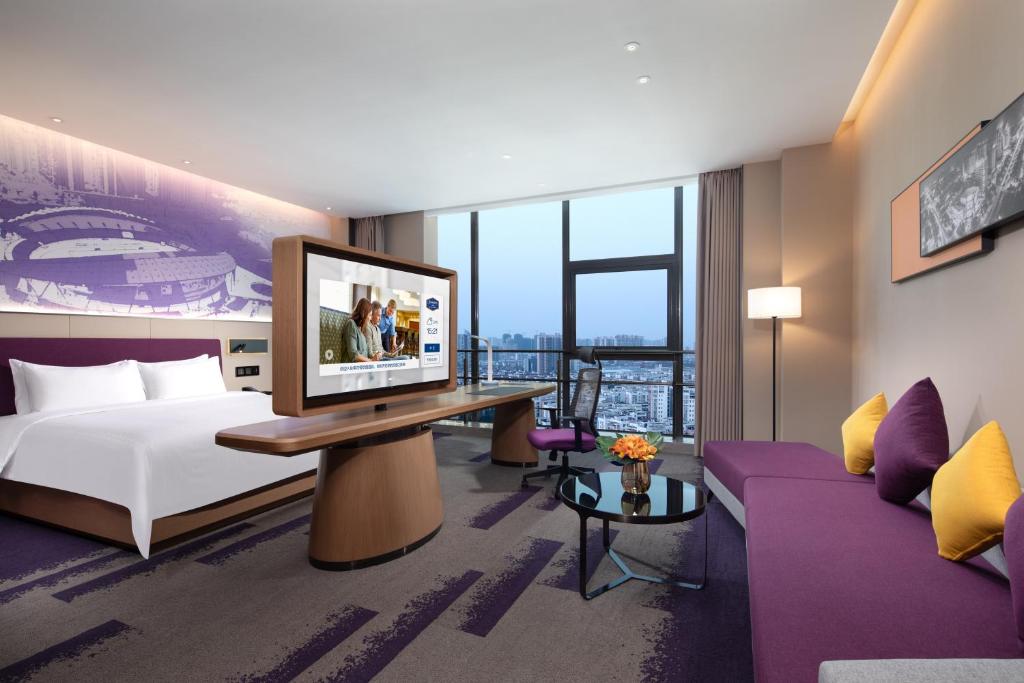 Postel nebo postele na pokoji v ubytování Hampton by Hilton Guigang