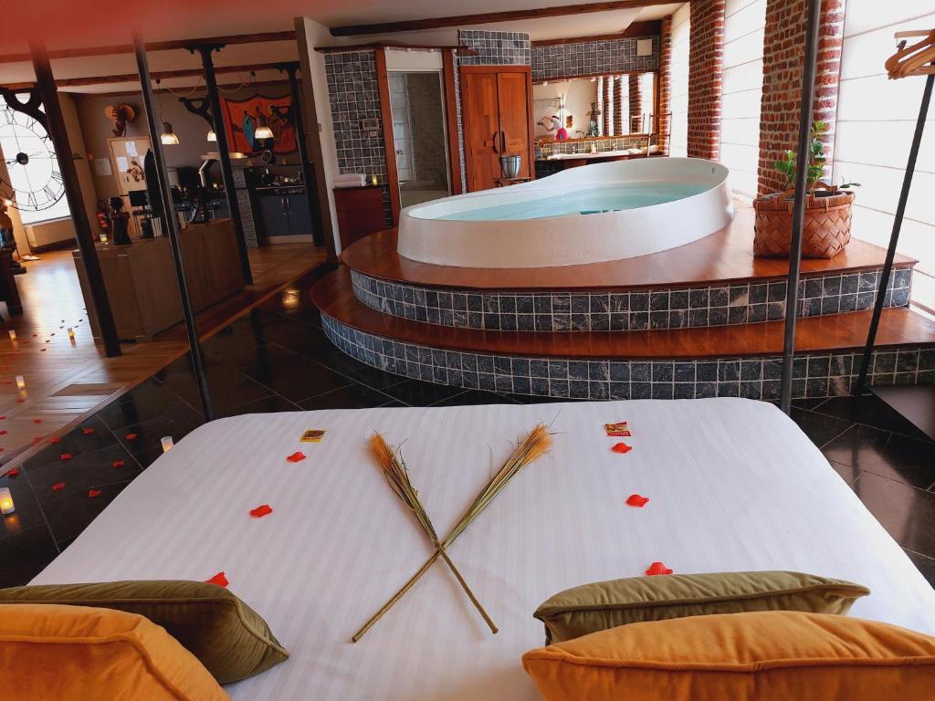 Postel nebo postele na pokoji v ubytování Baiser de Cupidon