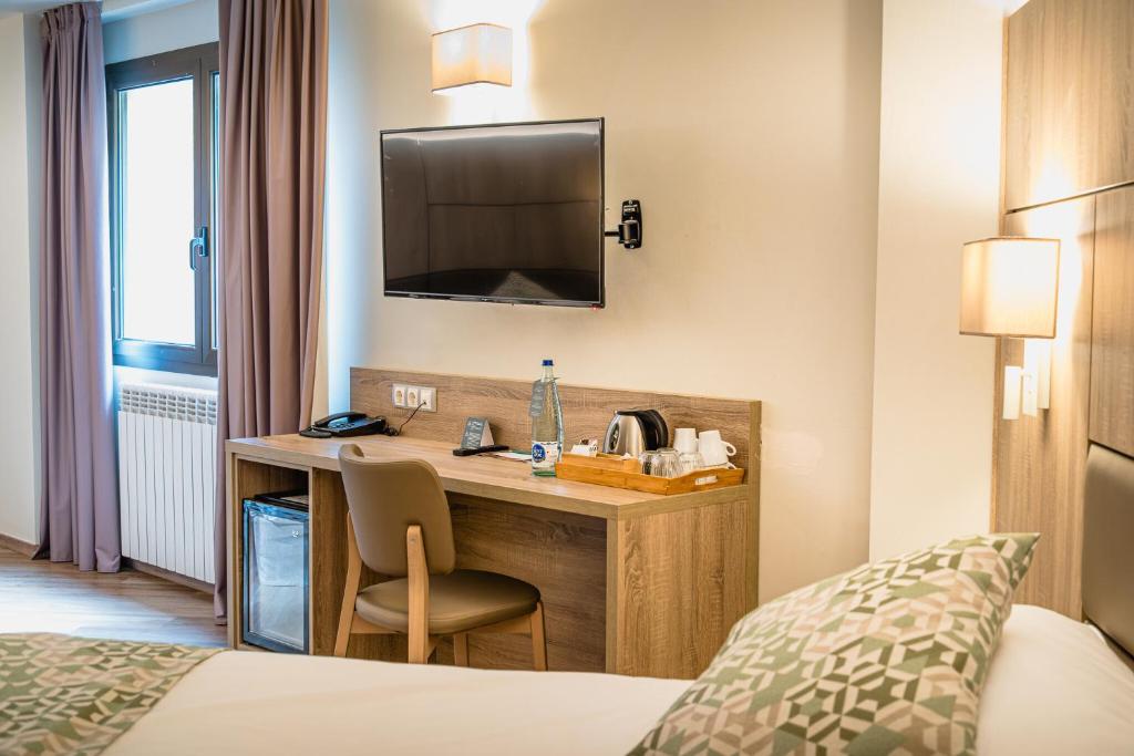 Postel nebo postele na pokoji v ubytování Hotel Princesa Parc