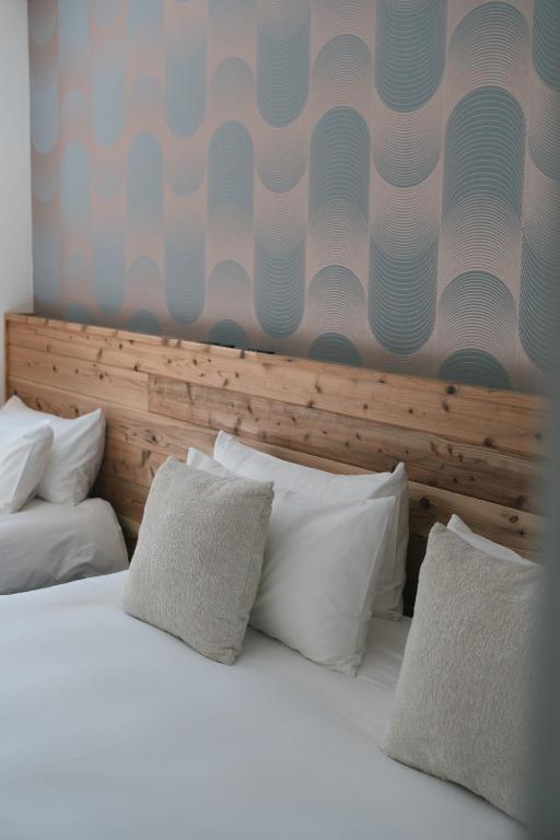 Postel nebo postele na pokoji v ubytování The Brueys Lodge Tangram Madarao