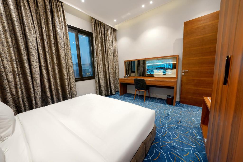 Postel nebo postele na pokoji v ubytování Namar Home serviced Apartment -Tuwaiq