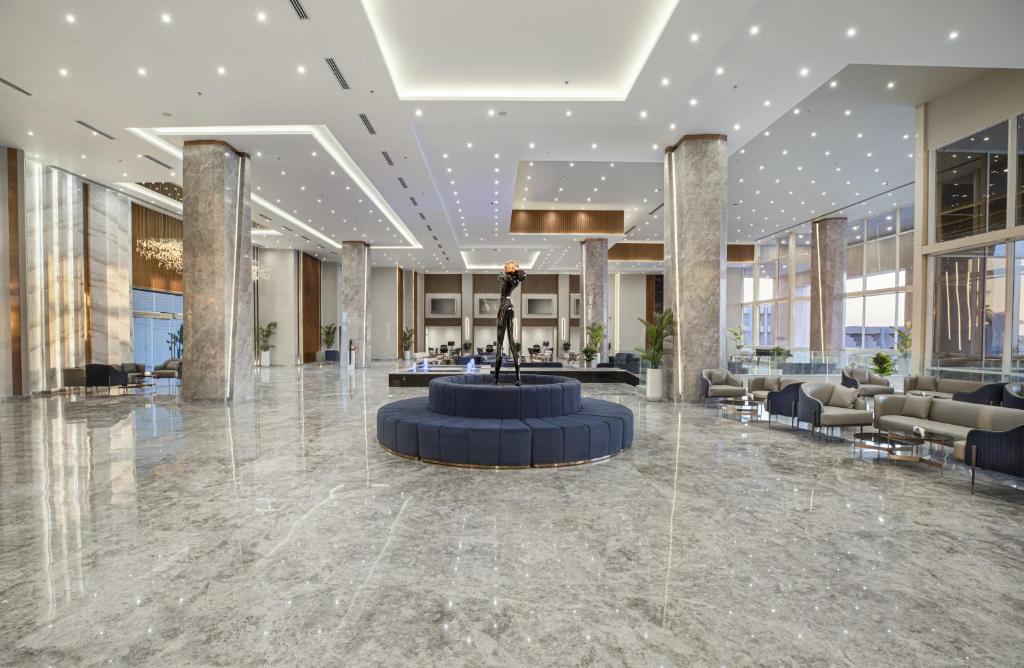 a lobby with a fountain in the middle of a building at V Hotel Sharm El Shiekh in Sharm El Sheikh