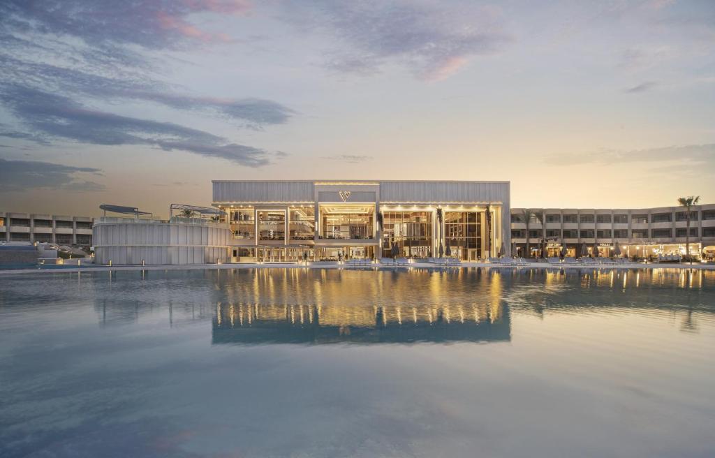 a large building with a pool of water in front of it at V Hotel Sharm El Shiekh in Sharm El Sheikh