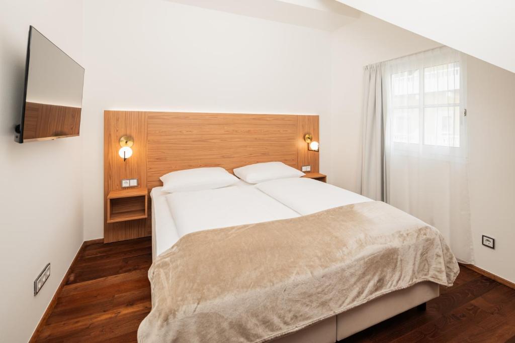 Postel nebo postele na pokoji v ubytování das zellersee
