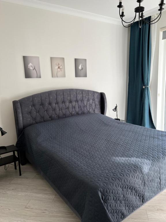 Llit o llits en una habitació de Cozy apartment
