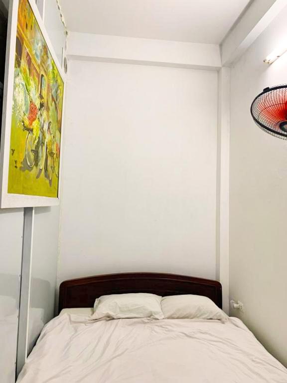 Postel nebo postele na pokoji v ubytování Mini Homestay