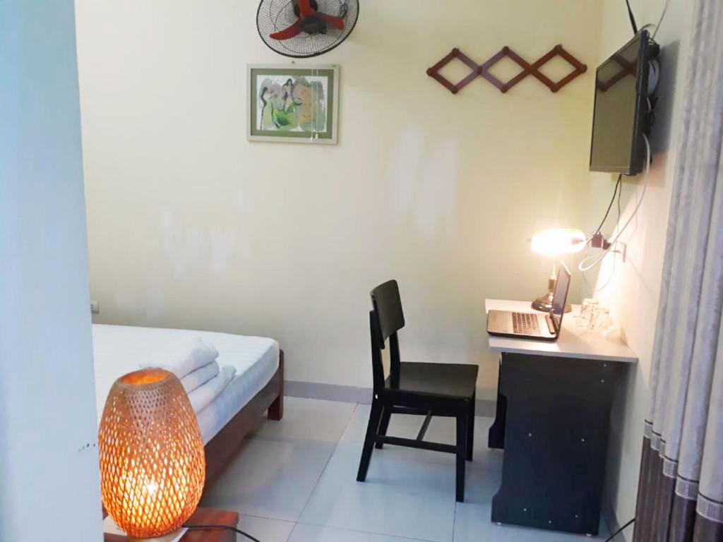 Postel nebo postele na pokoji v ubytování Mini Homestay