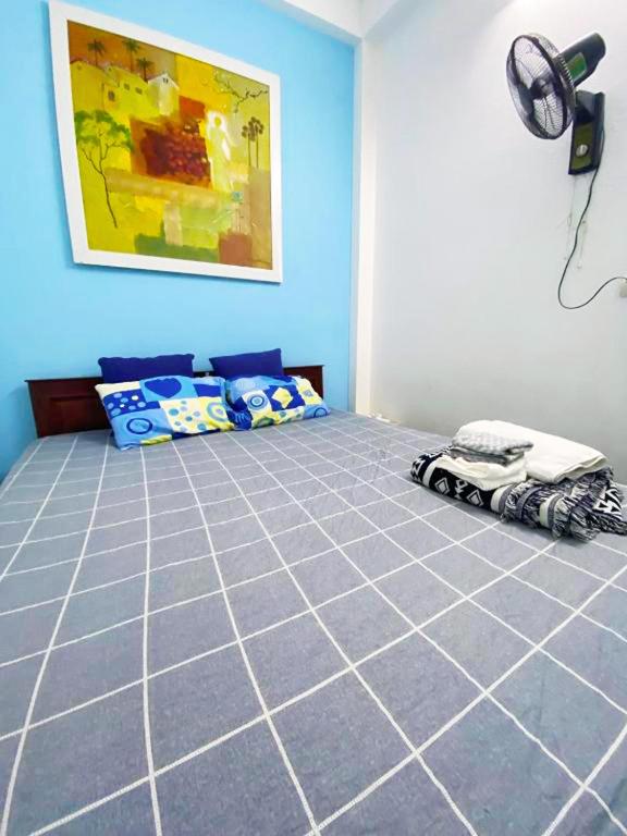Postel nebo postele na pokoji v ubytování Mini Homestay