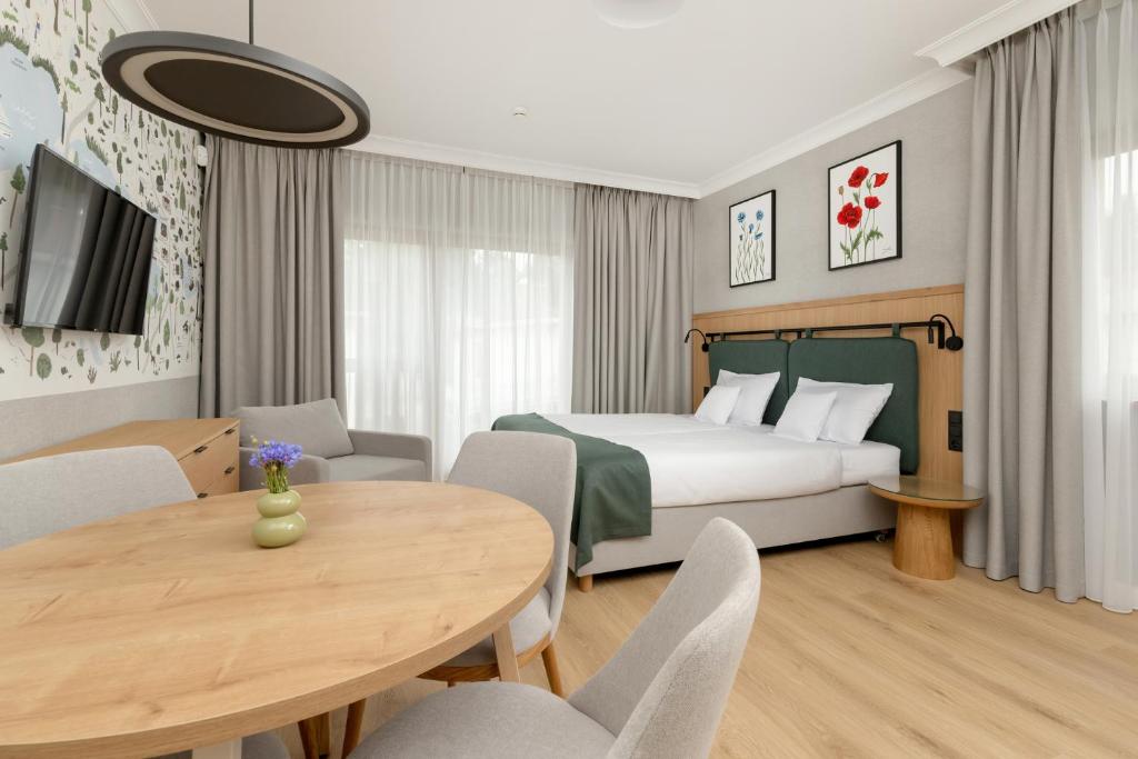 Postel nebo postele na pokoji v ubytování Modrak Apartamenty