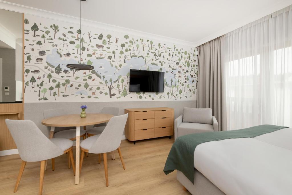 Postel nebo postele na pokoji v ubytování Modrak Apartamenty