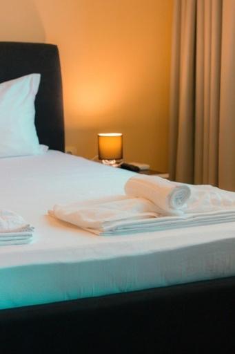 Postel nebo postele na pokoji v ubytování SPA Apartments Perun
