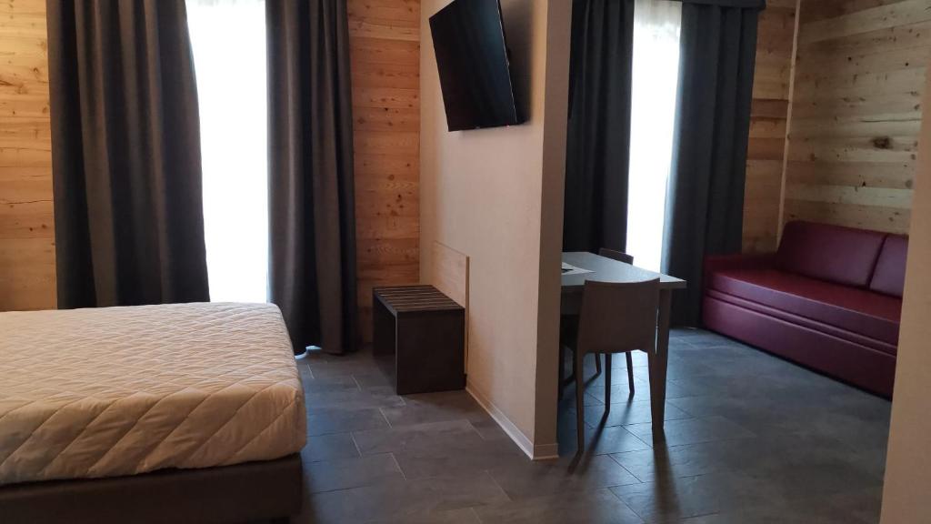 Postel nebo postele na pokoji v ubytování Albergo Rusen