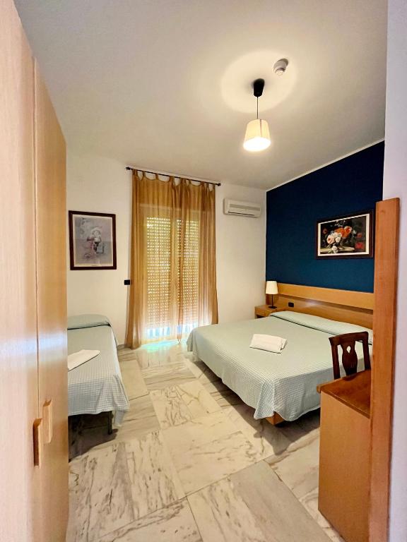 Postel nebo postele na pokoji v ubytování Hotel Praja