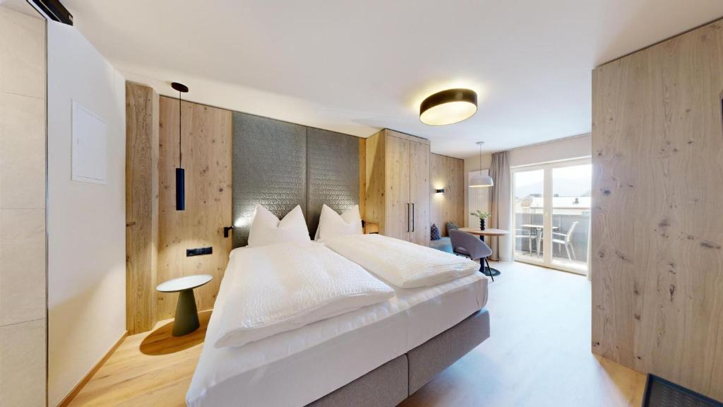 Postel nebo postele na pokoji v ubytování BUSSLEHNER Apartments