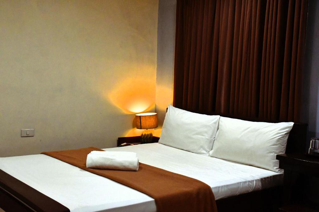 Postel nebo postele na pokoji v ubytování Arzo Hotel Makati