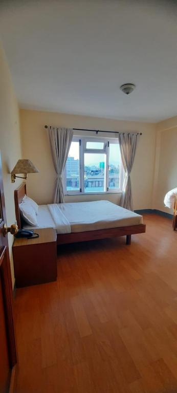 Postel nebo postele na pokoji v ubytování Hotel Sherwi Hyul