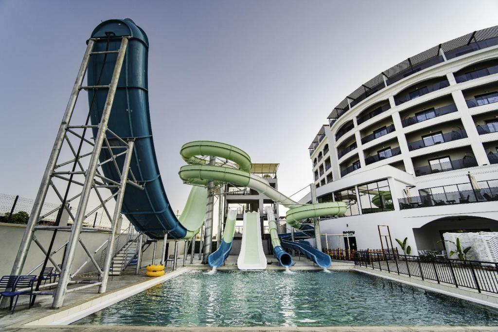 a water slide in front of a cruise ship at SIDE MOON PALACE in Side