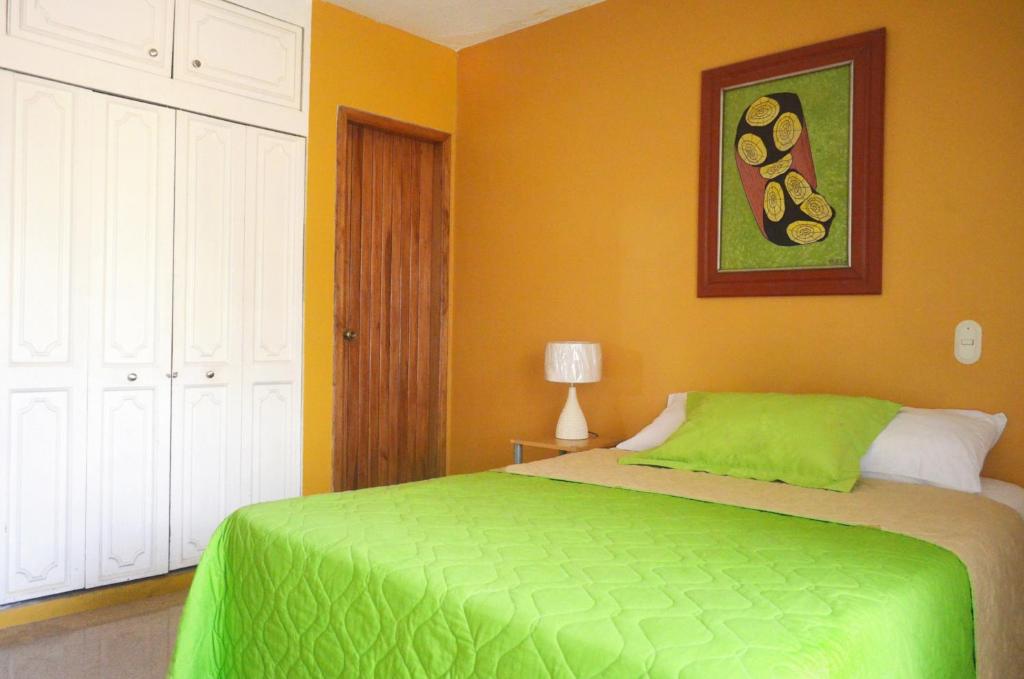 Postel nebo postele na pokoji v ubytování North Star Hostal Guayaquil