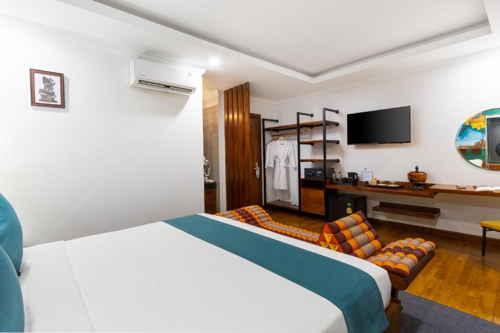 TV a/nebo společenská místnost v ubytování Le Vert Angkor Hotel