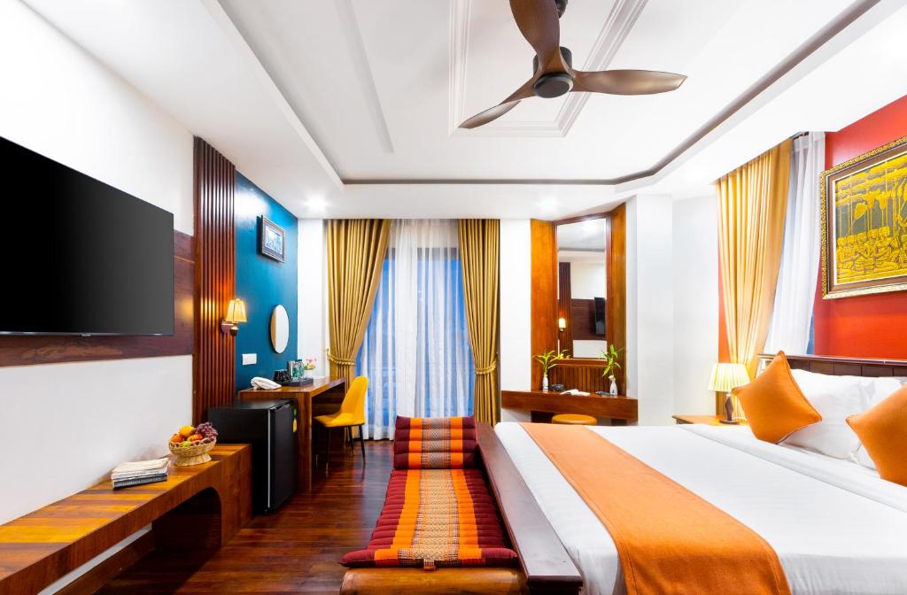 Postel nebo postele na pokoji v ubytování Le Vert Angkor Hotel