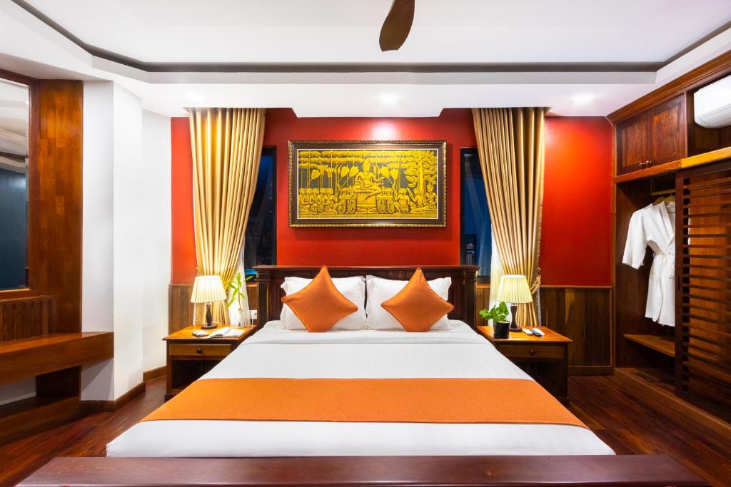 Postel nebo postele na pokoji v ubytování Le Vert Angkor Hotel