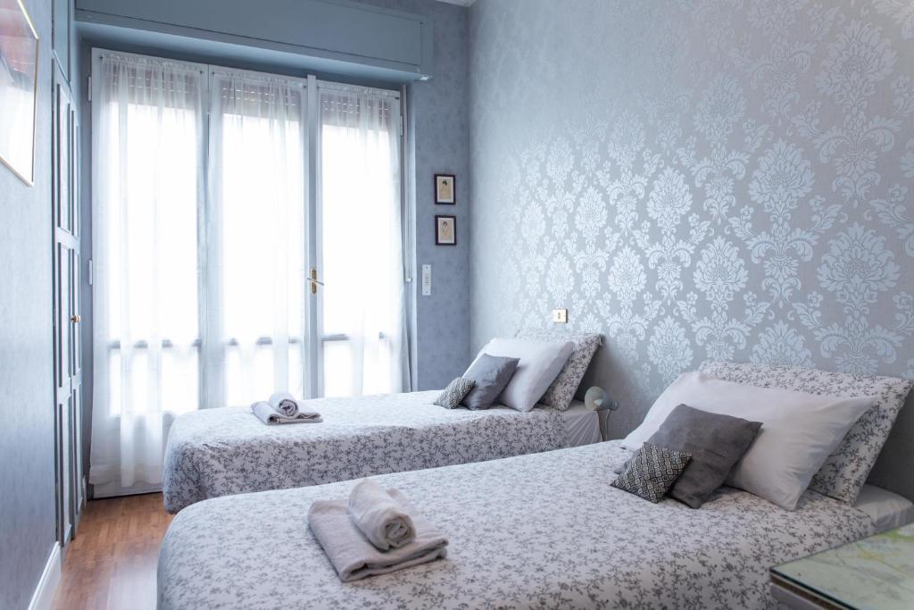 Posteľ alebo postele v izbe v ubytovaní [Duomo walking distance] elegant flat with view
